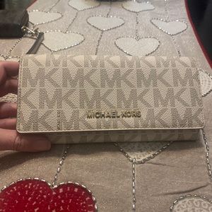 White leather Micheal Kors wallet.